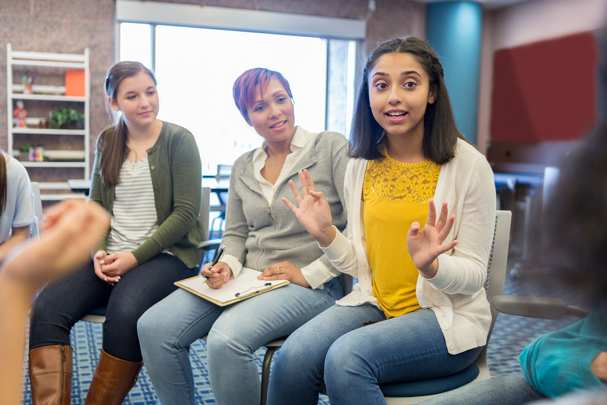 Open Up Resources 6-8 Math Students and Educators Having a Group Discussion