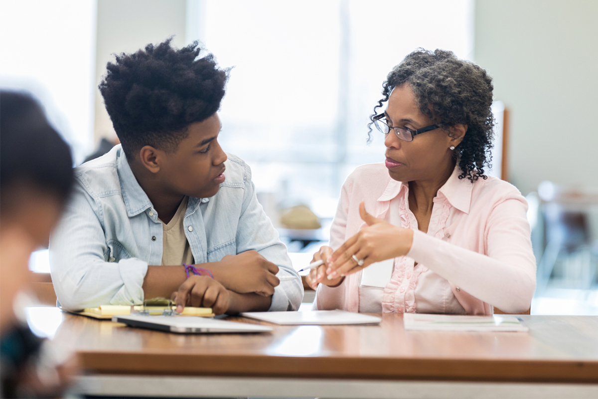 Open Up Resources Educator in a discussion with Black student
